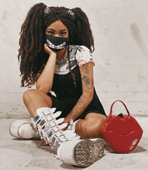 Gothic chic with space-age shimmer Damnedknee-high boots