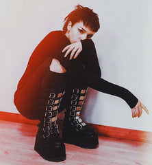 Gothic chic with space-age shimmer Damnedknee-high boots