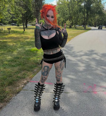 Gothic chic with space-age shimmer Damnedknee-high boots