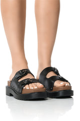 SLOW MOTION FLAT SANDAL IN BLACK